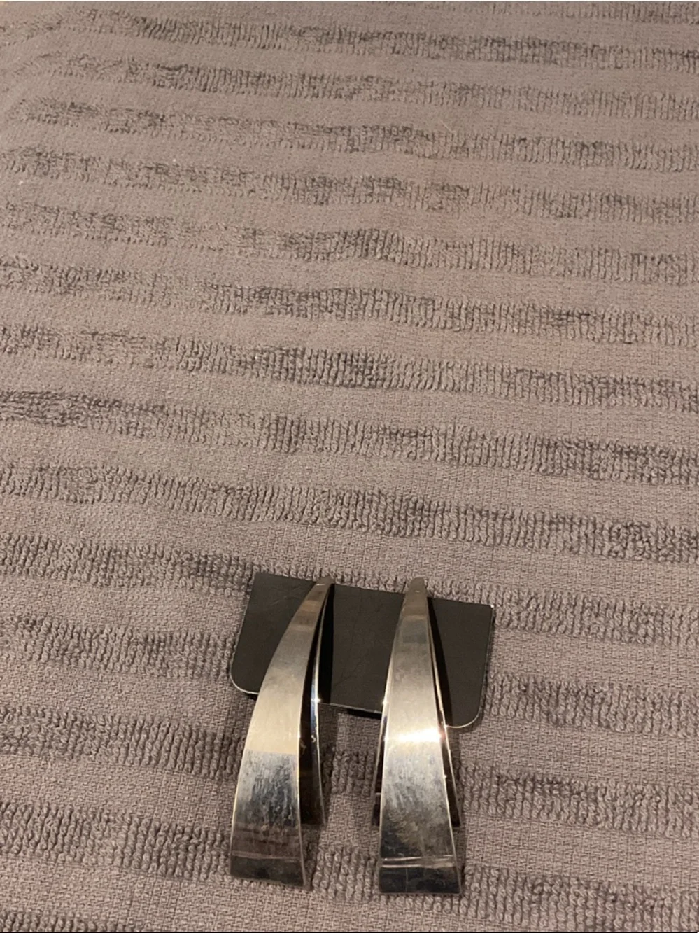 Silver tone earrings.